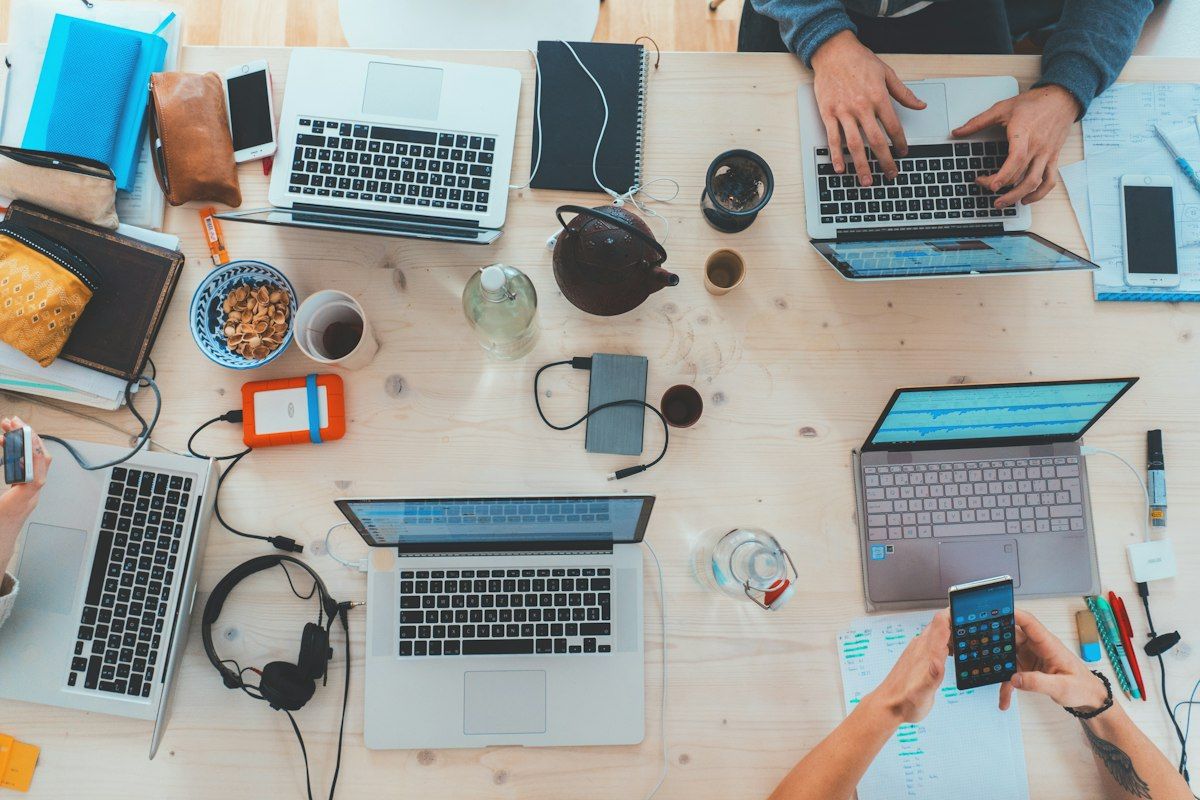 Remote team members working on laptops